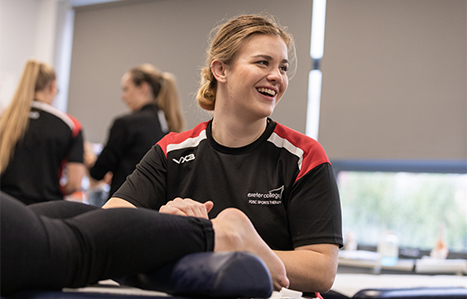 Sports therapy student working on a patients ankle